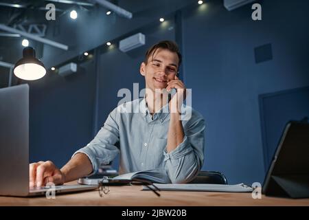 young businessman works in the office overtime at night. Stock Photo