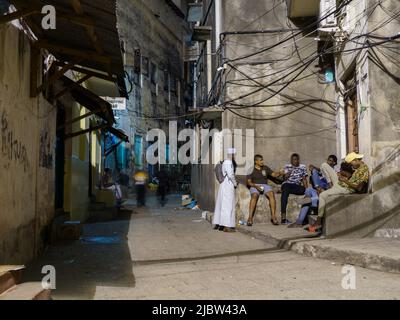 Stone Town, Zanzibar - February 2021: Nightlife in the narrow streets of Stone Town also known as Mji Mkongwe (swahili for 'old town') is the old part Stock Photo