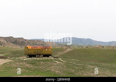 Abandoned Russian train car from Soviet era parked in countryside near Dedoplistskaro, Georgia, Caucasus Stock Photo