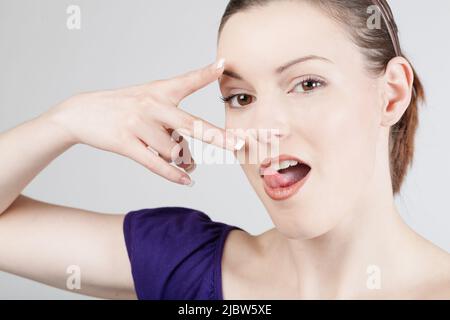 young woman shows emotional expressions Stock Photo