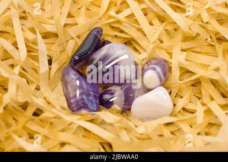 set of various amethyst natural mineral stones and gemstones on black background top view Stock Photo