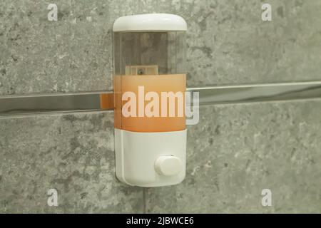 Automatic hand sanitizer machine or soap wall dispenser Stock Photo