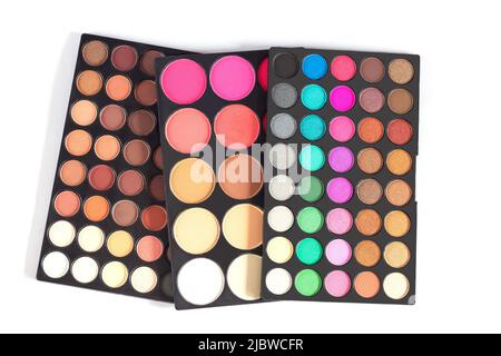 Palette of colorful round eye shadows isolated on white background Stock Photo