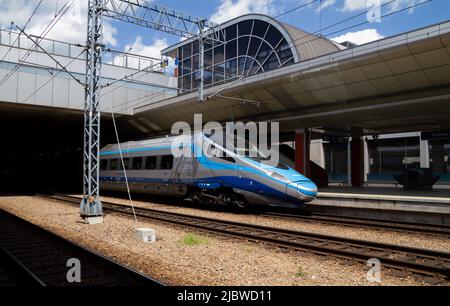 Premium express Pendolino train at Kraków Główny Main Railway Station. Polish state railways PKP modern high-speed Alstom EMU250 in Krakow, Poland. Stock Photo