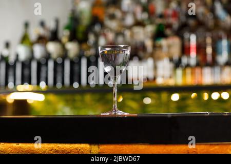 Aviation, drink with gin, lemon juice, maraschino liqueur and violet cream liqueur standing on bar counter Stock Photo