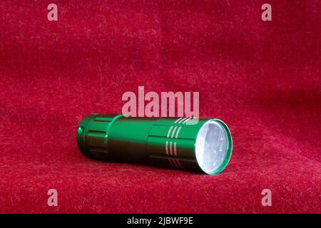 green torch on red cloth Stock Photo