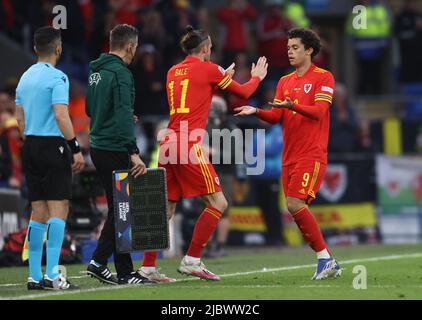 Cardiff, Wales, 8th June 2022.   Gareth Bale of Wales replaces Brennan Johnson of Wales during the UEFA Nations League match at the Cardiff City Stadium, Cardiff. Picture credit should read: Darren Staples / Sportimage Stock Photo