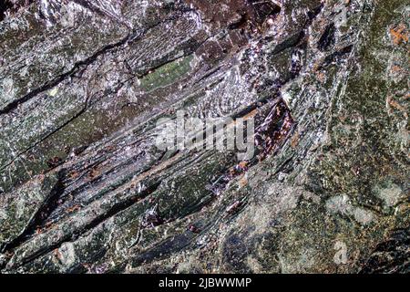 Potassium permanganate crystals under 4x magnification microscope, image width = 9mm. Abstract science  or chemistry background Stock Photo