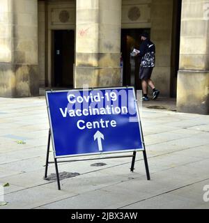 Sign for walk in centre to get vaccine to protect against Covid-19 or Covid or Coronavirus at the Town Hall in Manchester, England, United Kingdom. Stock Photo