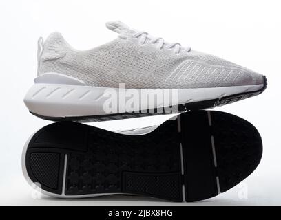 Sole and back view of sport shoes isolated on studio background Stock Photo