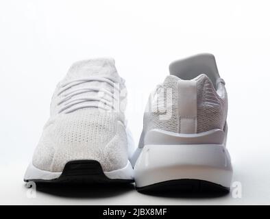 Back and front view of sport shoes isolated on studio background Stock Photo