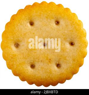 Crispy salted round cracker on white table Stock Photo