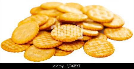 Crispy salted round crackers on white table Stock Photo