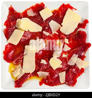 Appetizing raw veal carpaccio served with cheese Stock Photo