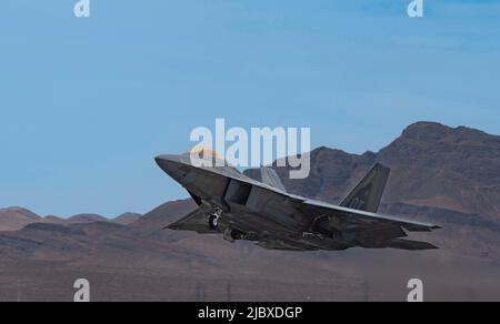 An F-22 Raptor assigned to the 422nd Test and Evaluation Squadron lands ...