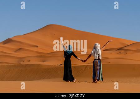 Premium Photo | Beautiful young woman posing in the desert sand