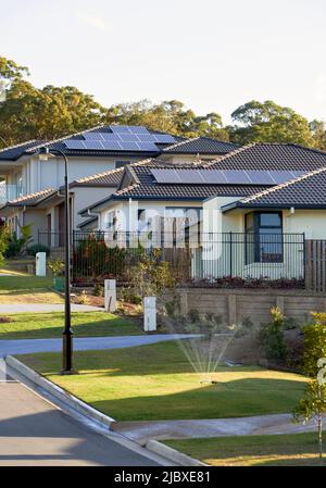 Solar panels on urbane homes roofs Stock Photo
