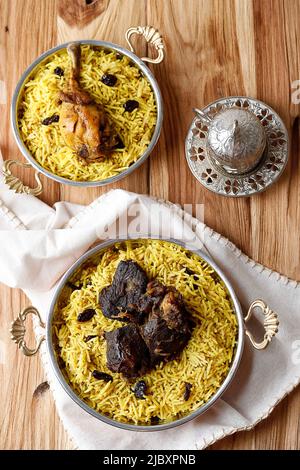 Top View Chicken and Mutton  Biryani Kebuli Rice on Wooden Table Stock Photo