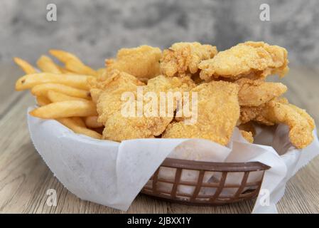 Delicious basket of fried fish and chips for a tasty fastfood seafood