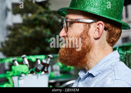 Young redhead irish man wearing t-shirt standing over isolated grey ...