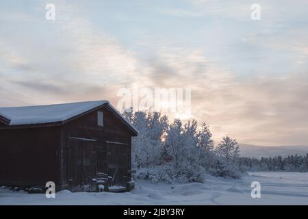 Serene sunset Winter scene in Swedish Lapland Stock Photo