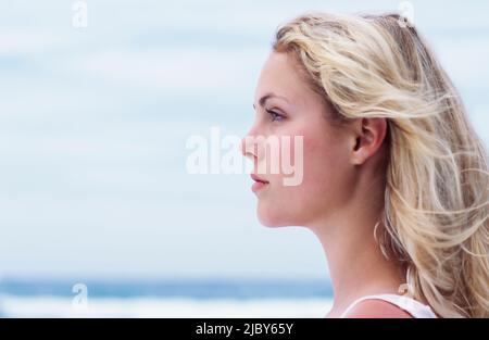 Portrait of young woman at the beach Stock Photo