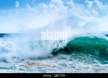 Huge wave curling over and breaking during cyclone Ola Stock Photo