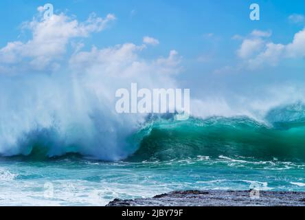 Huge wave curling over and breaking during cyclone Ola Stock Photo