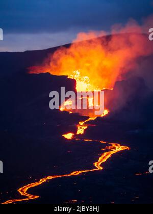 Crater eruption and glowing river of magma from Fagradalsfjall Volcanic eruption at Geldingadalir, Iceland Stock Photo