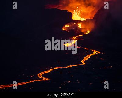 Crater eruption and glowing river of magma from Fagradalsfjall Volcanic eruption at Geldingadalir, Iceland Stock Photo