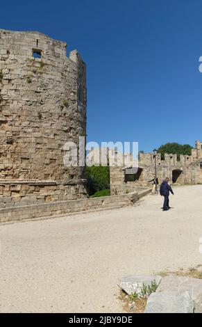 Person walking around old town walls, Rhodes Town, Rhodes Island, Greece, Dodecanese. Spring 2022. May. Stock Photo