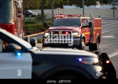 Police, fire, and paramedic units respond to the scene of an emergency. Stock Photo