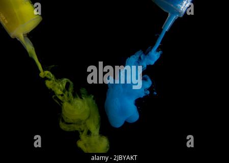 Color drop in water isolated on white background Stock Photo
