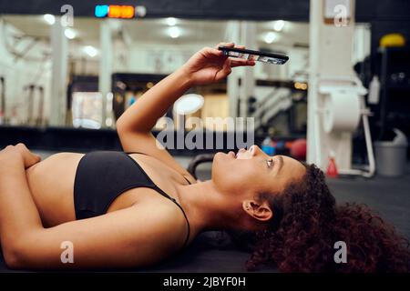 African woman, gym selfie and floor for fitness, workout or