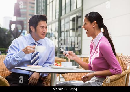 Couple having breakfast together in cafe Stock Photo
