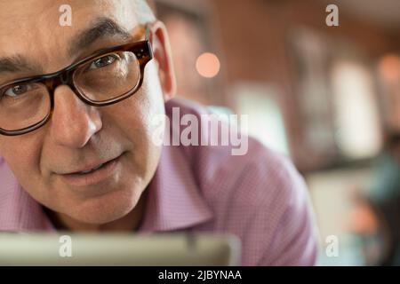 Close up of serious man wearing eyeglasses Stock Photo