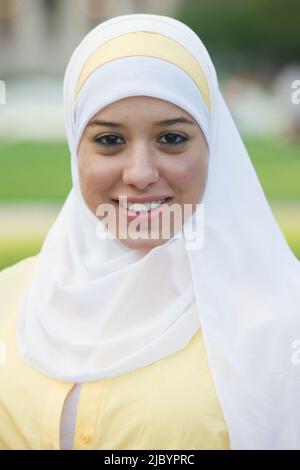 Muslim teenager smiling Stock Photo
