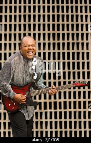 African musician playing electric guitar Stock Photo