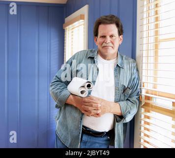 Architect holding blueprints Stock Photo