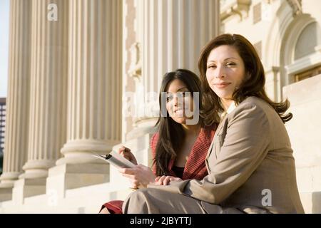 Multi-ethnic businesswomen with paperwork Stock Photo
