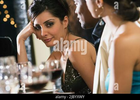 Portrait of Middle Eastern woman at dinner party Stock Photo