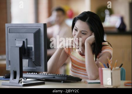 Asian businesswoman at desk Stock Photo