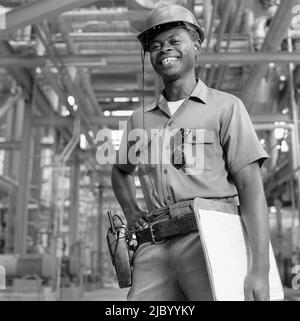 African American male welder with clipboard Stock Photo