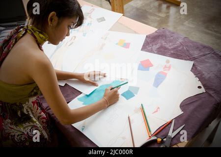Indian female fashion designer drawing Stock Photo