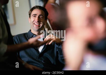 Co-workers talking Stock Photo