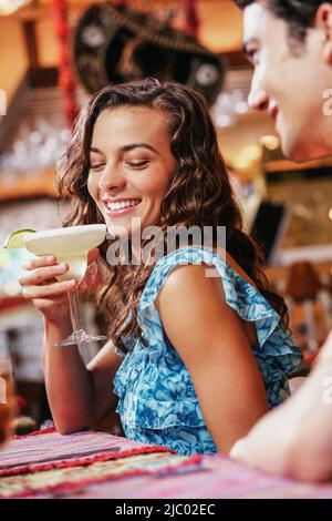 Couple drinking drinks in restaurant Stock Photo