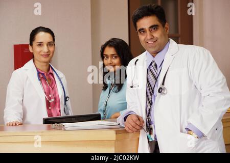 Doctors and nurses smiling for the camera Stock Photo