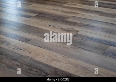 Luxury vinyl flooring with look of hard wood natural floor texture for background. Stock Photo