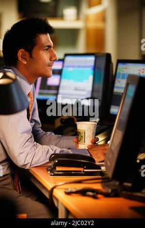 Middle aged businessman working at his desk Stock Photo