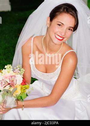 Bride posing for the camera Stock Photo